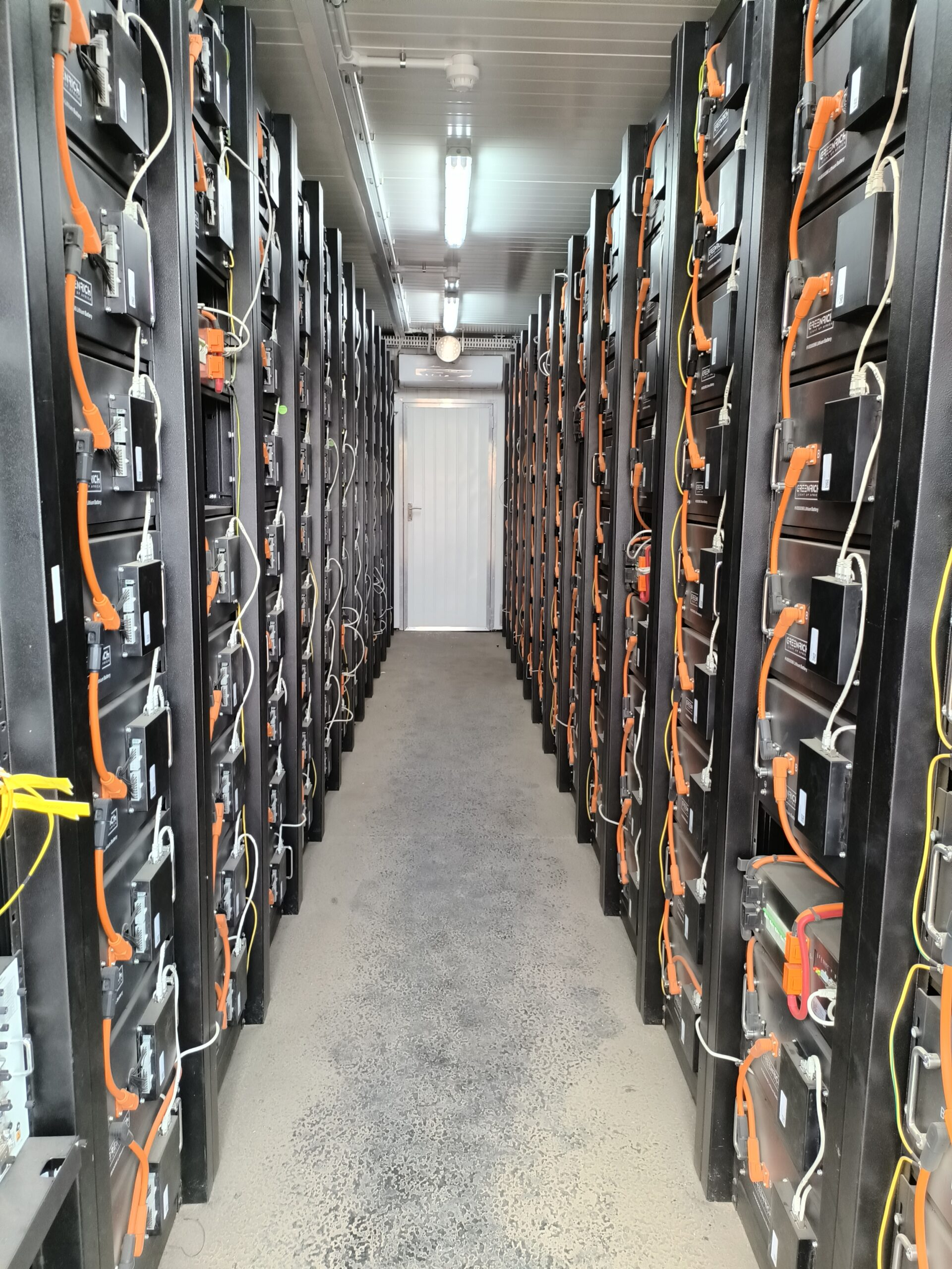 Battery storage racks inside a container BESS system
